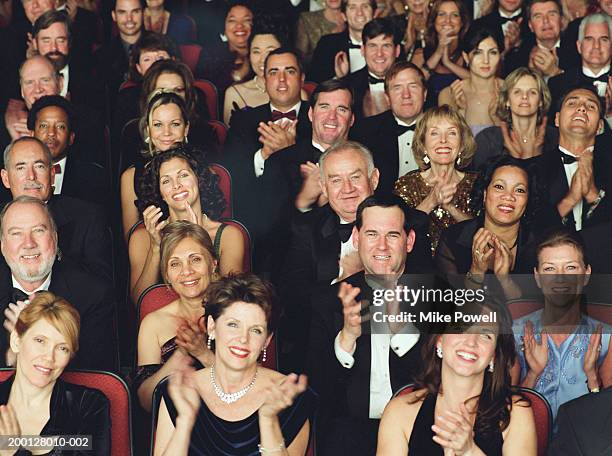 theater audience in formal attire, applauding, portrait - opera theatre stockfoto's en -beelden