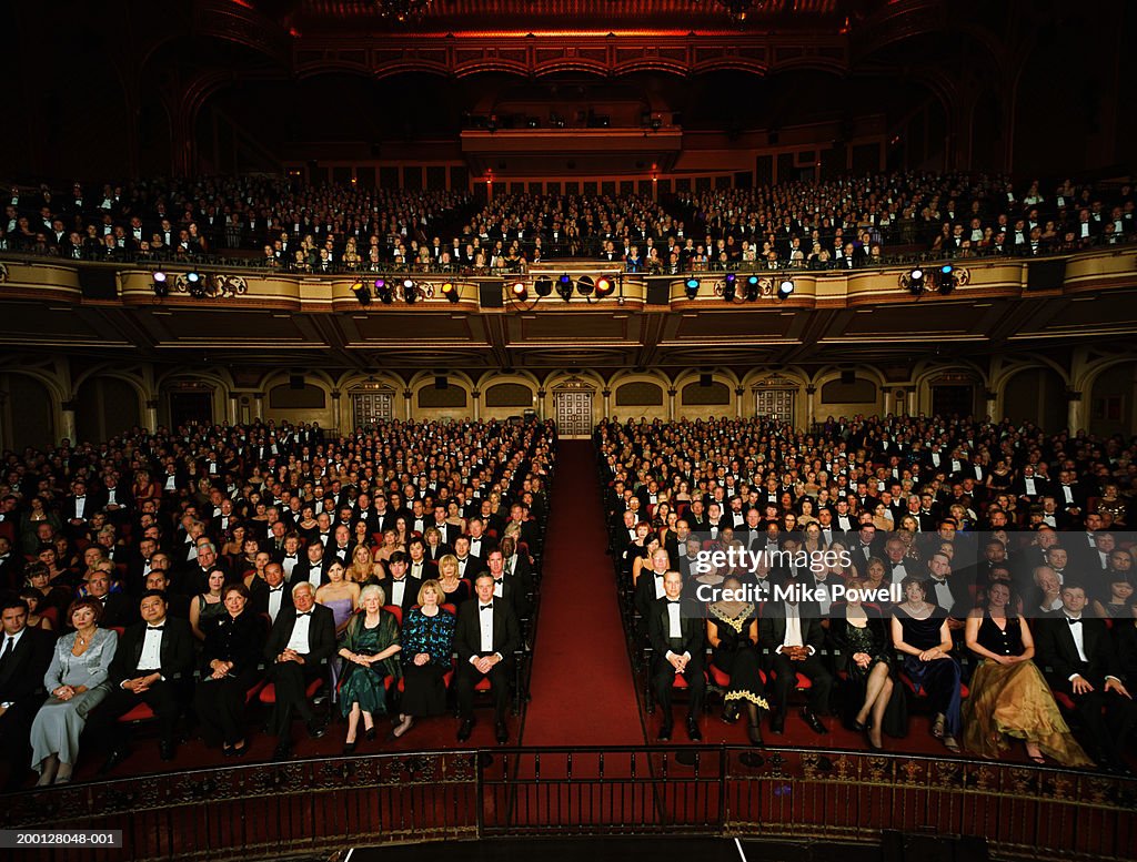 Theater audience in formal attire