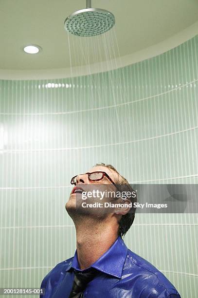 man wearing glasses, shirt and tie in shower, head back - välklädd bildbanksfoton och bilder