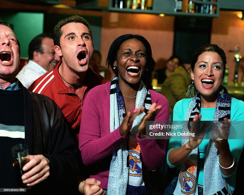 Freinds Clapping Group Of Friends Shouting And Clapping In Bar High-Res Stock Photo ...