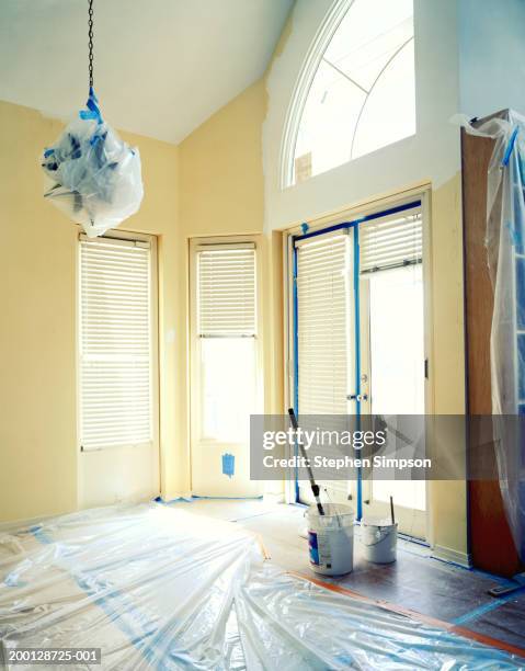 room covered with protective tape and plastic for painting - protective sheet stock pictures, royalty-free photos & images