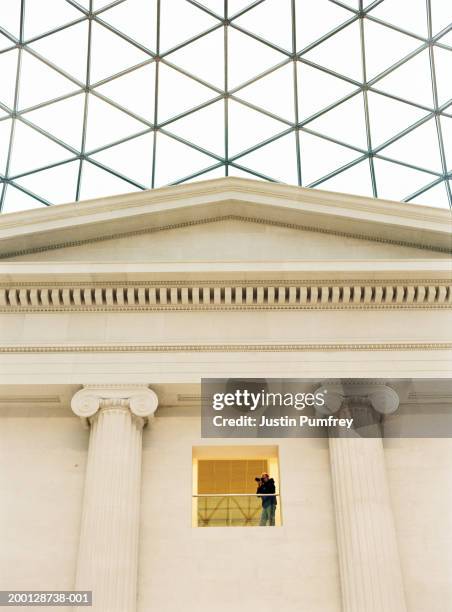 england, london, british museum, man taking photograph, low angle view - british museum stock pictures, royalty-free photos & images