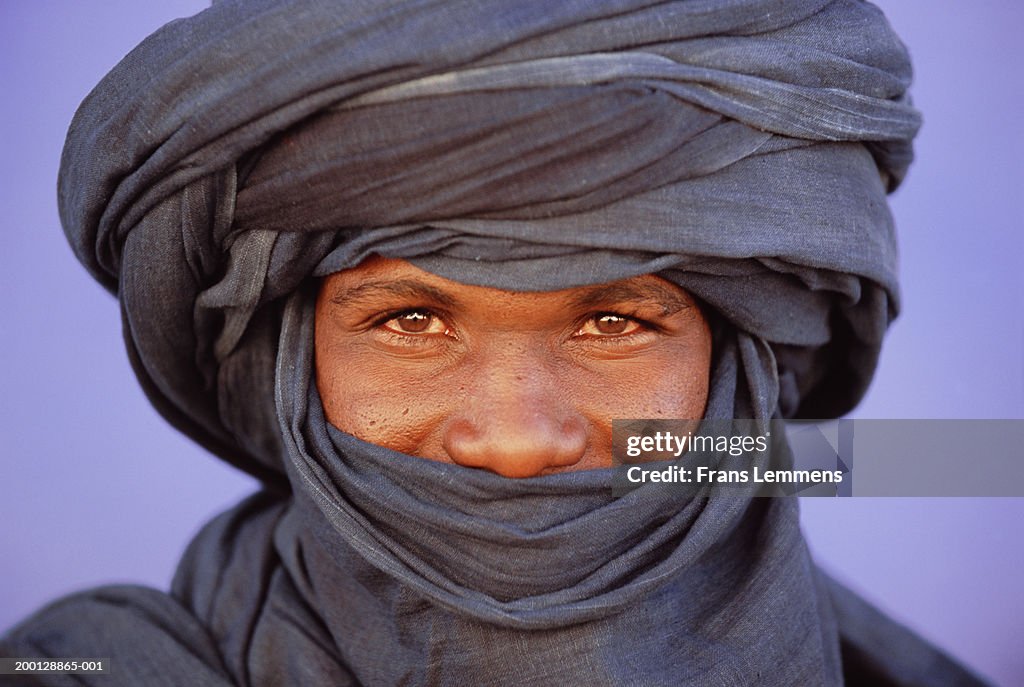 Man wearing traditional Tuareg headdress, portrait, close-up