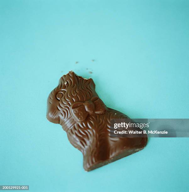 chocolate easter bunny with ears bitten off - chocolate bunny stock pictures, royalty-free photos & images