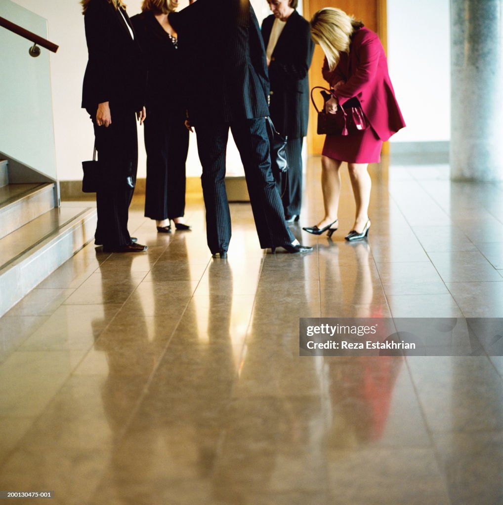 Group of women standing in hotel lobby
