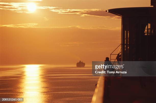 sunset over water, viewed from cruise ship - inside passage stock pictures, royalty-free photos & images