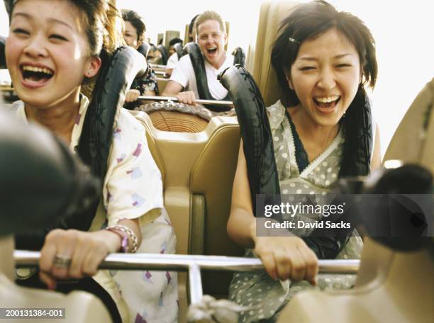 people on rollercoaster - young woman screaming on a rollercoaster stock pictures, royalty-free photos & images