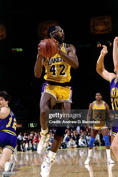 James Worthy of the Los Angeles Lakers grabs a rebound against the Utah Jazz during the 1989 season NBA game at the Great Western Forum in Los...