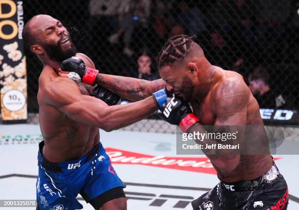 Michael Johnson and Darrius Flowers trade punches in a lightweight fight during the UFC Fight Night event at UFC APEX on February 10, 2024 in Las...