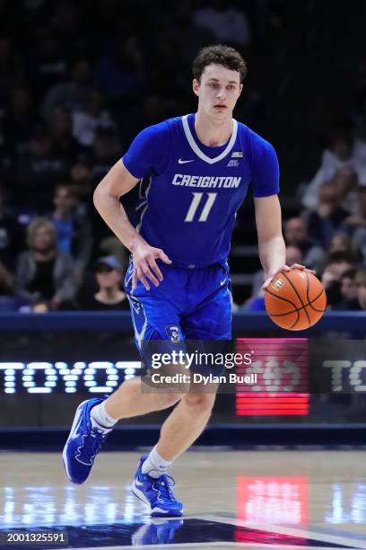 Ryan Kalkbrenner of the Creighton Blue Jays dribbles the ball in the second half against the Xavier Musketeers at the Cintas Center on February 10,...