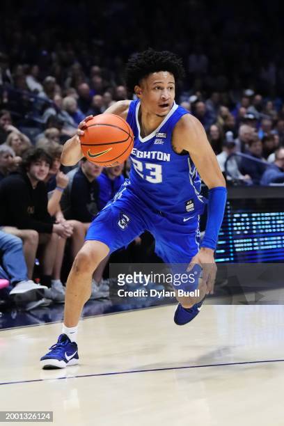 Trey Alexander of the Creighton Blue Jays dribbles the ball in the second half against the Xavier Musketeers at the Cintas Center on February 10,...