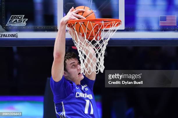 Ryan Kalkbrenner of the Creighton Blue Jays dunks the ball in the first half against the Xavier Musketeers at the Cintas Center on February 10, 2024...