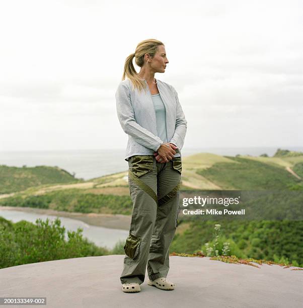 woman standing outdoors - blond undone bildbanksfoton och bilder