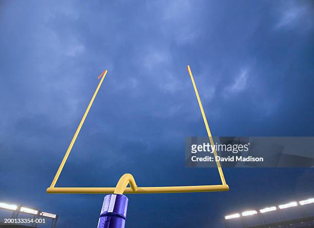 american football goalpost, night (digital composite) - football goal post stock pictures, royalty-free photos & images