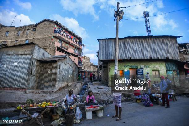 Peddlers sell local delicacies at the street stalls that are open until late hours in Nairobi, Kenya on February 9, 2024. The Samosas and Maize are...