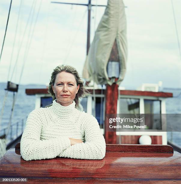 woman wearing sweater, standing on bow of sailboat, portrait - women's water polo bildbanksfoton och bilder