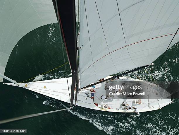crew working on deck of sailing ocean going racing yacht - sailing race from above stock pictures, royalty-free photos & images