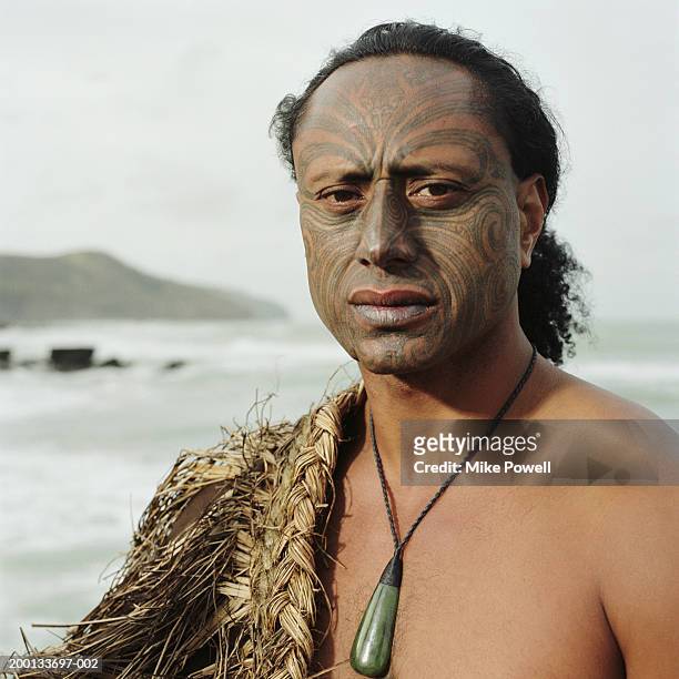 maori warrior with ta moko tattoo on face, portrait - maori stock-fotos und bilder