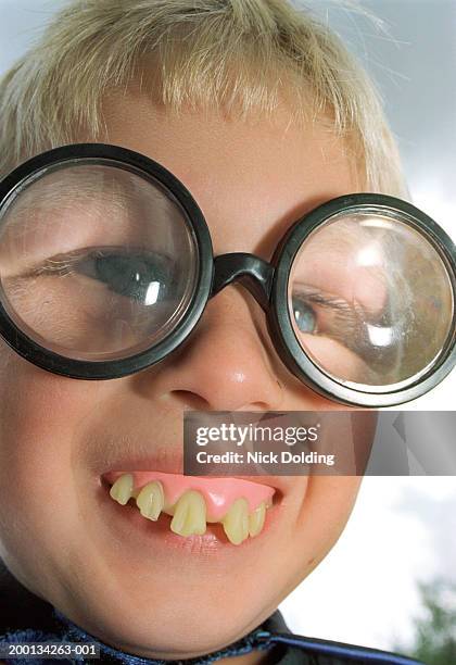 Boy Wearing False Teeth And Comical Spectacles Closeup High-Res Boy Wearing False Teeth And Comical Spectacles Closeup High-Res