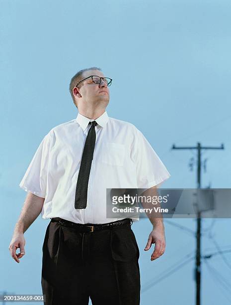 man wearing shirt and tie standing outdoors, blue sky background - hjälte bildbanksfoton och bilder
