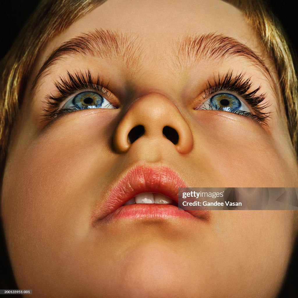 Boy (4-6) looking up, close up (Digital Enhancement)