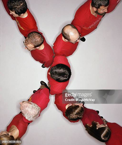 group of adults standing in 'x' formation, overhead view - letter x fotografías e imágenes de stock