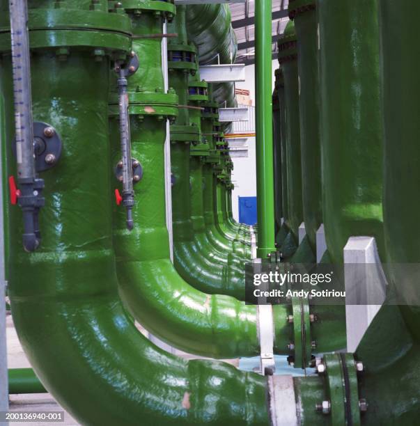 pipes carrying untreated water to pumping hall at desalination plant - reverse osmosis stock pictures, royalty-free photos & images