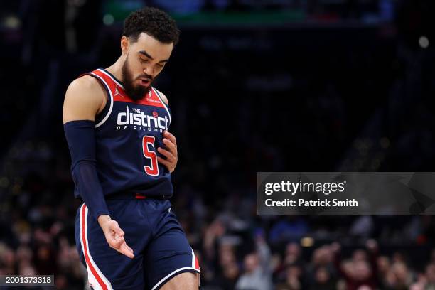 Tyus Jones of the Washington Wizards celebrates after scoring a three-pointer against the Philadelphia 76ers during the first half at Capital One...