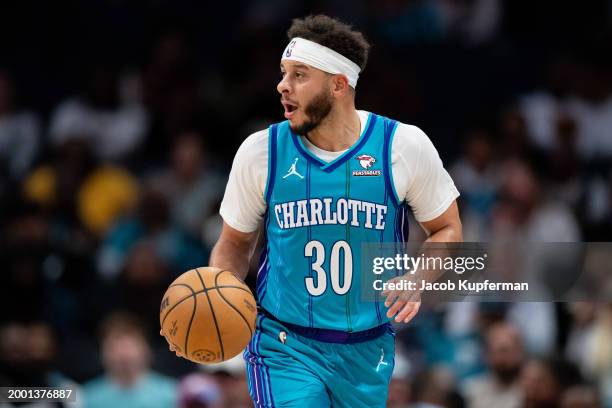 Seth Curry of the Charlotte Hornets brings the ball upcourt in the second quarter during their game against the Memphis Grizzlies at Spectrum Center...