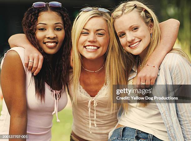 three teenage girls (16-18) smiling, portrait - finger waves foto e immagini stock
