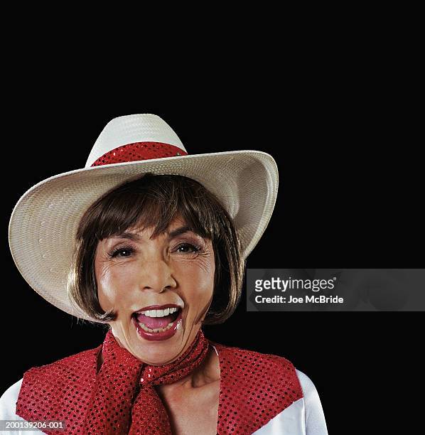 senior woman wearing cowgirl costume smiling, portrait - cowgirl hairstyles fotografías e imágenes de stock