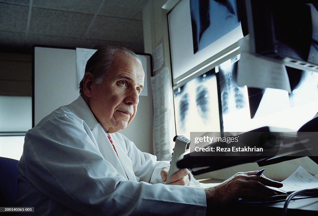 Real Radiologists Computer Radiologist Looking At Computer Screen Xrays In Background High-Res ...