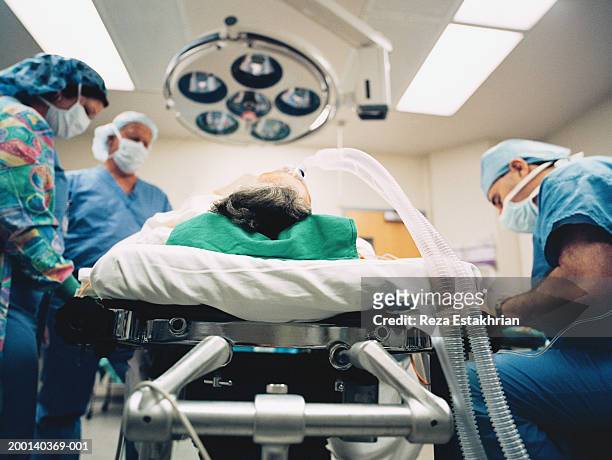 patient attached to respirator at beginning of operation - unconscious stock-fotos und bilder