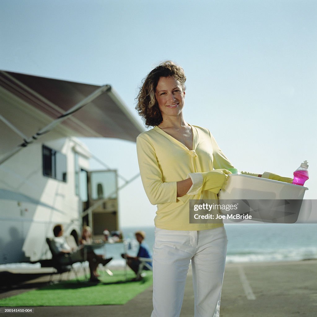 Woman In Rv Woman Holding Tupperware With Dishes And Soap Rv Camping With Family ...