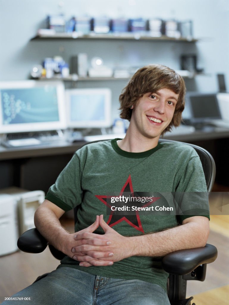 Young Man Sitting In Computer Lab Portrait High-Res Stock Photo - Getty ...