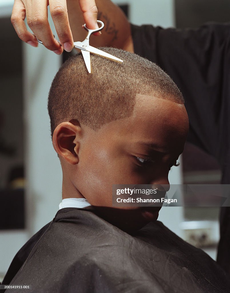 Boy In Barbers Chair Getting Hair Cut Closeup High-Res Stock Photo - Getty  Images