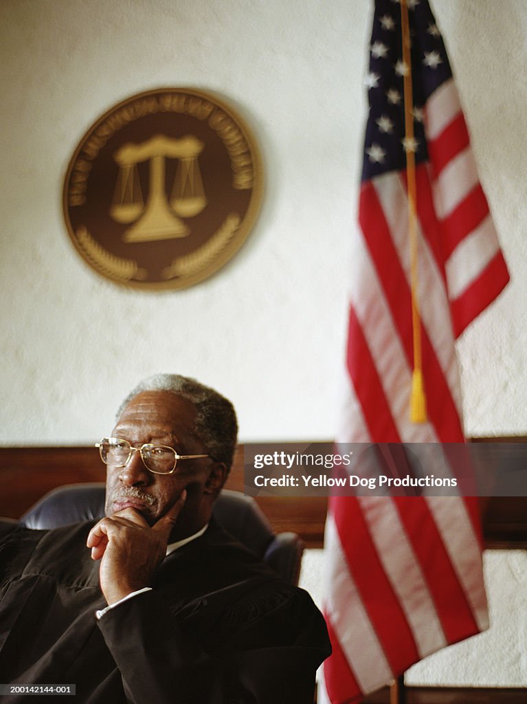 Mature male judge in courtroom