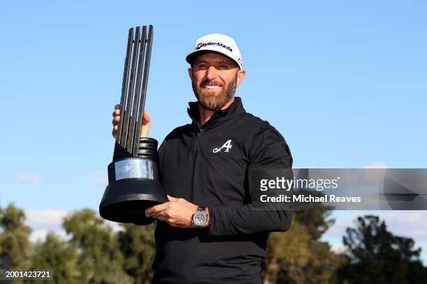 Captain Dustin Johnson of 4Aces GC poses with the individual trophy after winning during day three of the LIV Golf Invitational - Las Vegas at Las...
