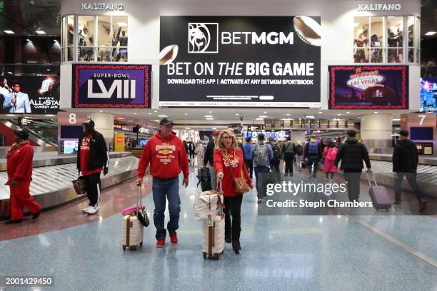 Kansas City Chiefs fans make their way inside Harry Reid International Airport ahead of Super Bowl LVIII on February 10, 2024 in Las Vegas, Nevada.