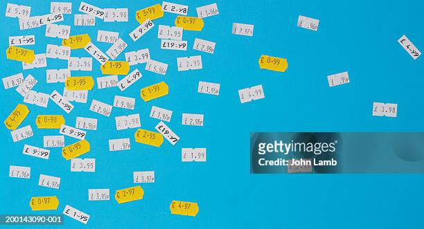 price stickers in english currency on blue background - consumerism foto e immagini stock