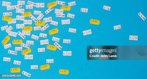 price stickers in english currency on blue background - prijs stockfoto's en -beelden