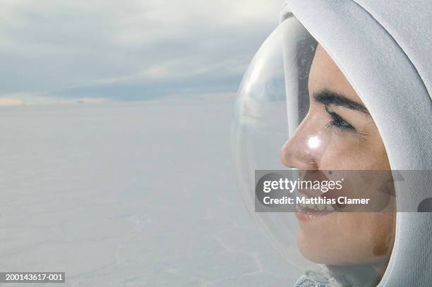 young woman wearing protective bubble on face, side view, close-up - stoneplus4 stock pictures, royalty-free photos & images