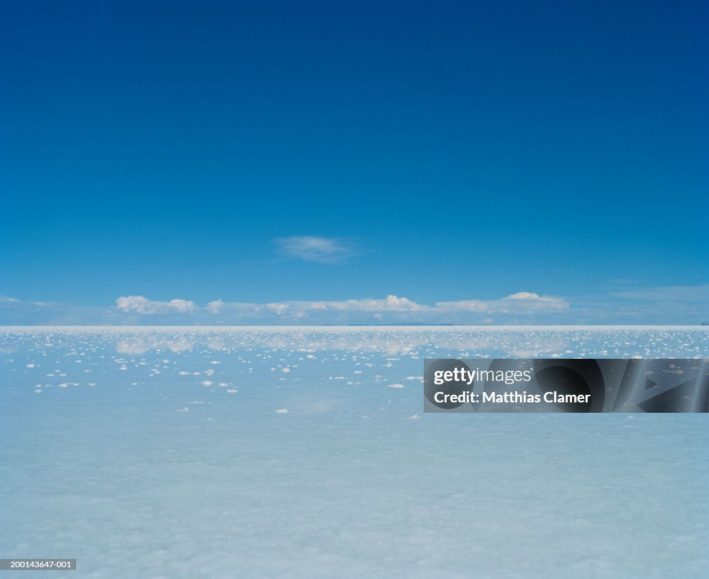 Salt flat under blue sky