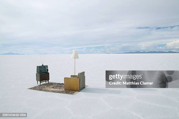 armchair and television on salt flat, elevated view - salt flats stock pictures, royalty-free photos & images