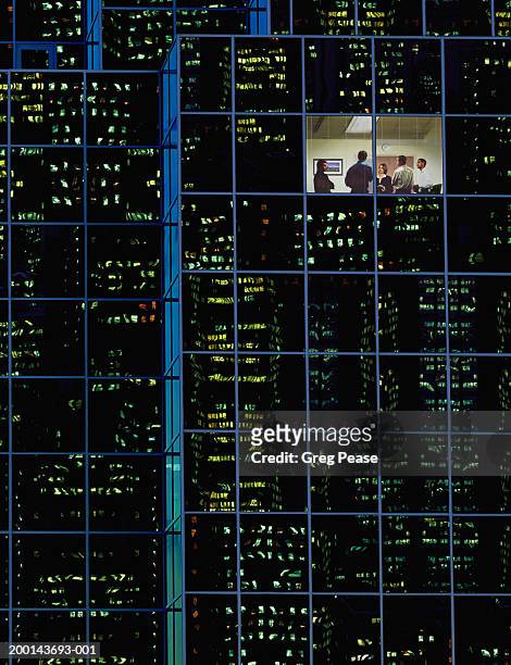 group of people in room of office building, night (digital composite) - building dedication stock pictures, royalty-free photos & images