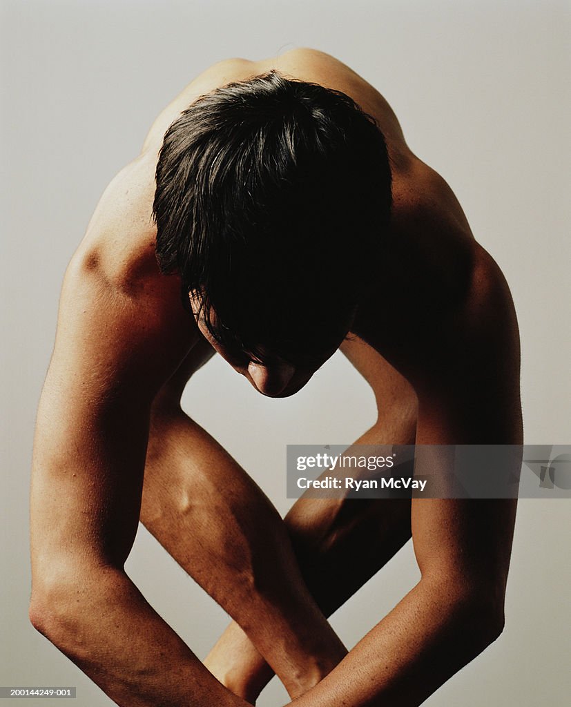 Male ballet dancer holding pose, close-up