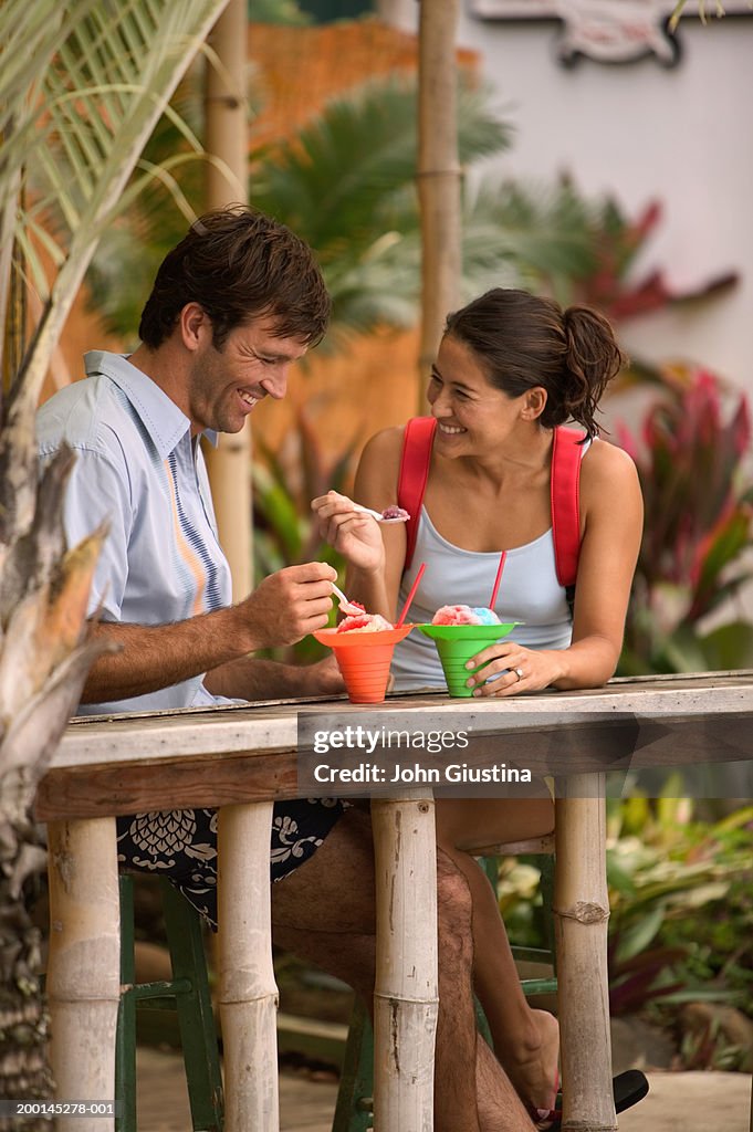 Couple eating snow cones