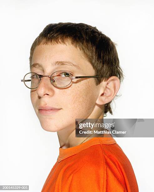 teenage boy (13-15) wearing glasses, close-up, portrait - stoneplus4 stock pictures, royalty-free photos & images