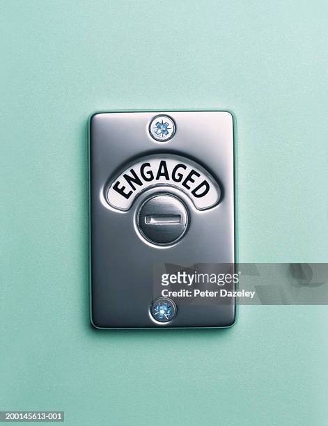 'engaged' lock, close up - restroom sign 個照片及圖片檔