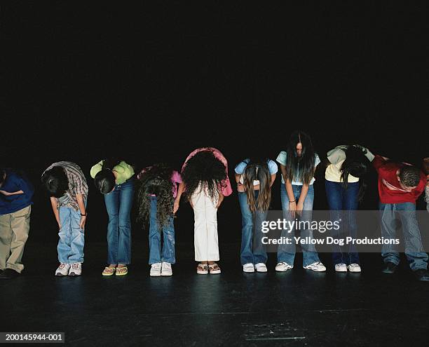 group of kids (12-14) on stage bowing - recita della scuola foto e immagini stock